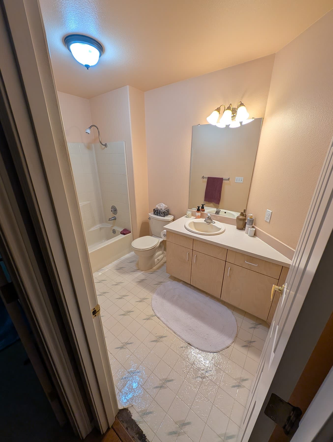Builder-grade hall bathroom before remodel